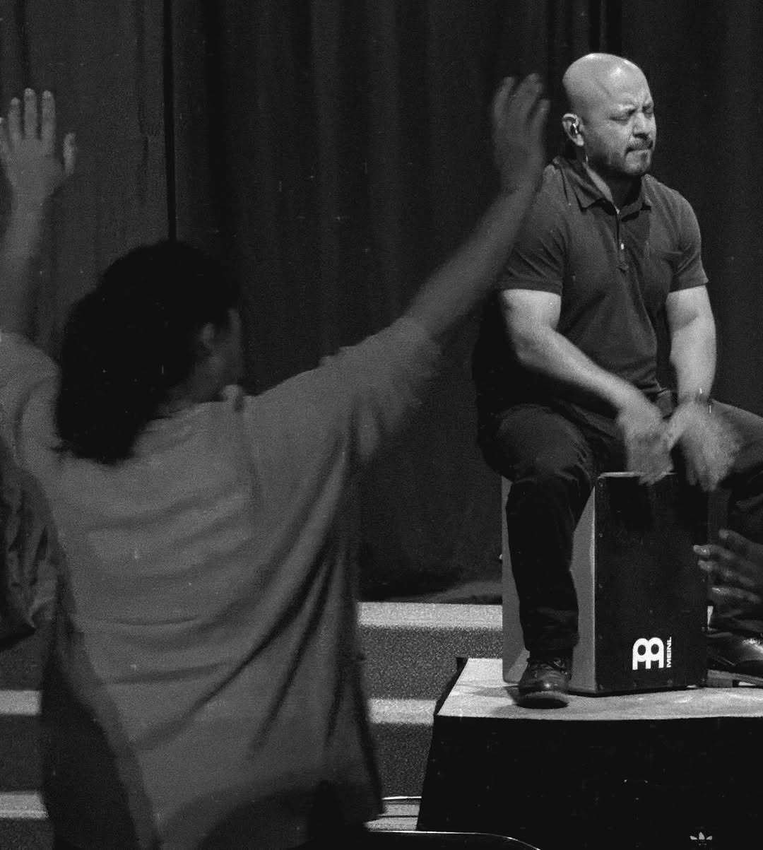 A musician leading worship at an Authentic Community Church gathering